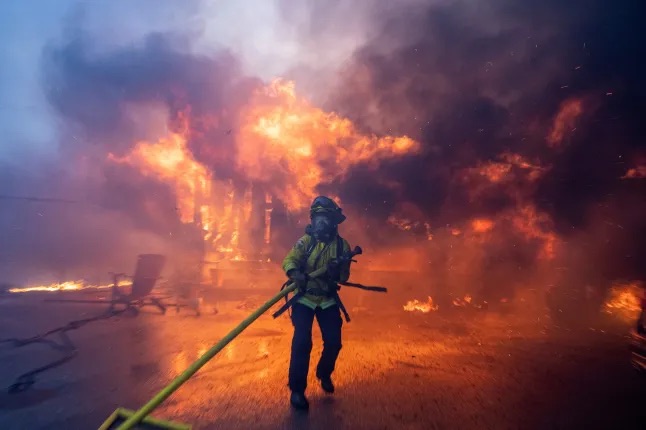 Firefighter battling intense flames